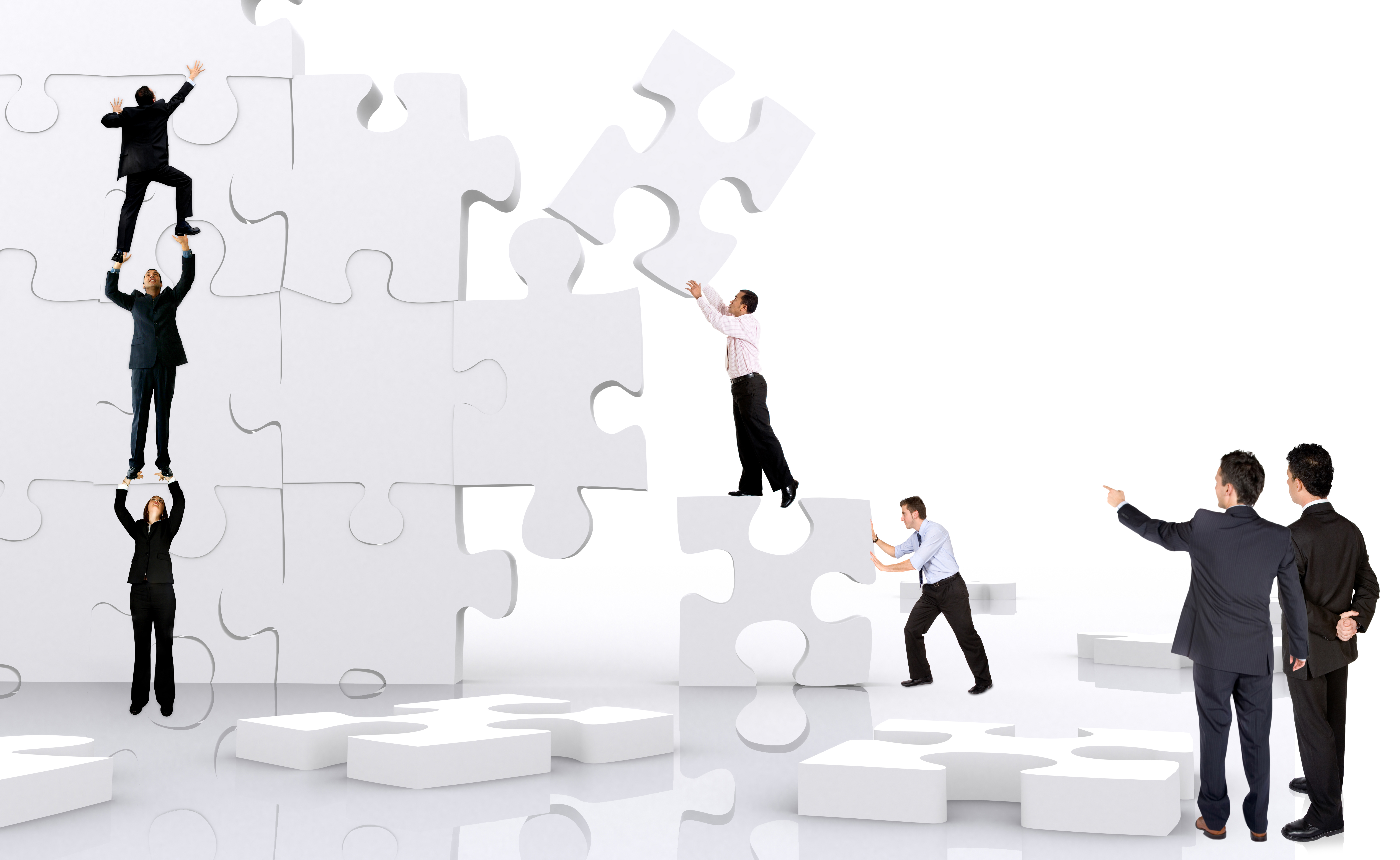 business team work building a puzzle isolated over a white background